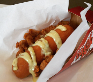Illustration for article titled KFC's Double Down hot dog is a sausage wrapped in a fried chicken bun